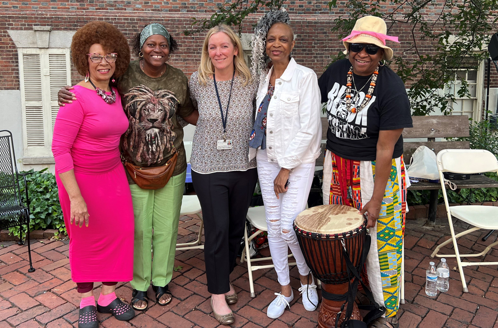 Susan Kruse Sullivan, CRNP, MSN, center, with members of the Sistahs Laying Down Hands Collective.